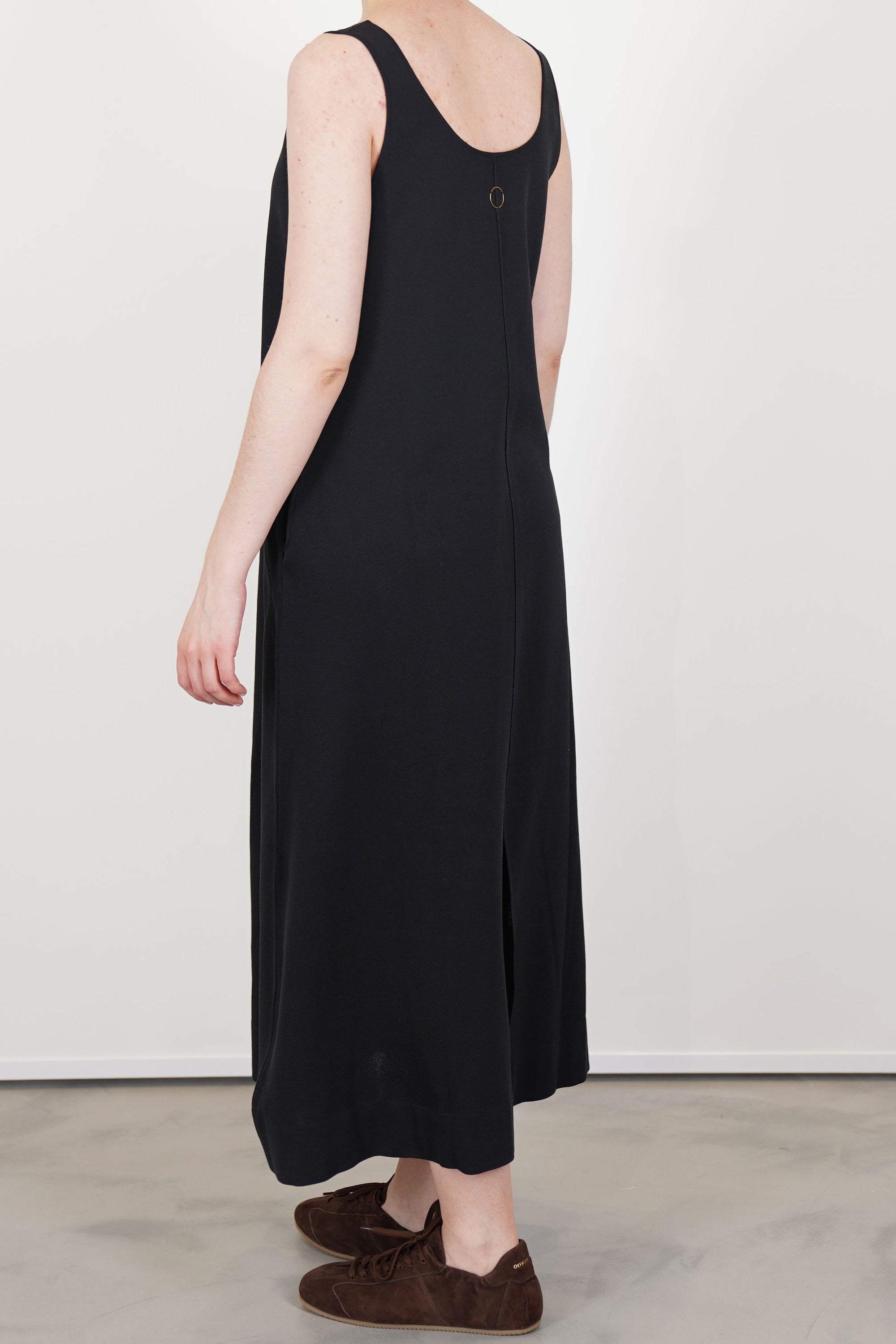 back view of oyuna quiet knitted cotton dress black