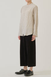 side view of pas de calais dobby stripe shirring brushed blouse ivory chest pocket detail, button front opening and a relaxed and loose cut. 
