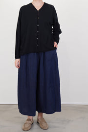 pas de calais cardigan cotton linen black combined with trousers for a minimalist and structural design