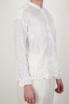 profile view of pas de calais crinkle stand collar shirt white long sleeves and crinkled material