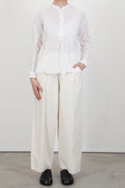 model wearing pas de calais crinkle stand collar shirt white