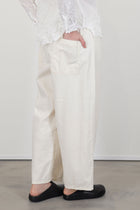 profile back view of pas de calais natural denim easy pants ivory back patch pocket details