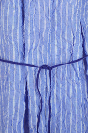 detail view of pas de calais shirring stripe dress saxe blue soft washed cotton material with intentionally crinkled optic