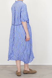 profile view of pas de calais shirring stripe dress saxe blue soft and loose drape, back yoke detail for ease of movement