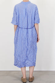 back view of pas de calais shirring stripe dress saxe blue structural cut, midi length and short sleeves