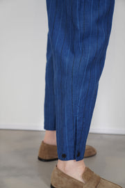 close up view of pas de calais striped cropped pants linen indigo tapered leg and soft linen material