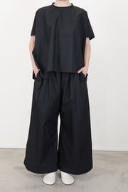 model wearing sofie d'hoore shirt basker black paired with matching trousers for a minimlaist and elegant design