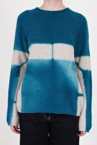 suzusan cashmere seamless pullover long dark teal sand featuring a loose and relaxed fit, slimmer fitted sleeves and rolled up details at the hemline and cuffs.