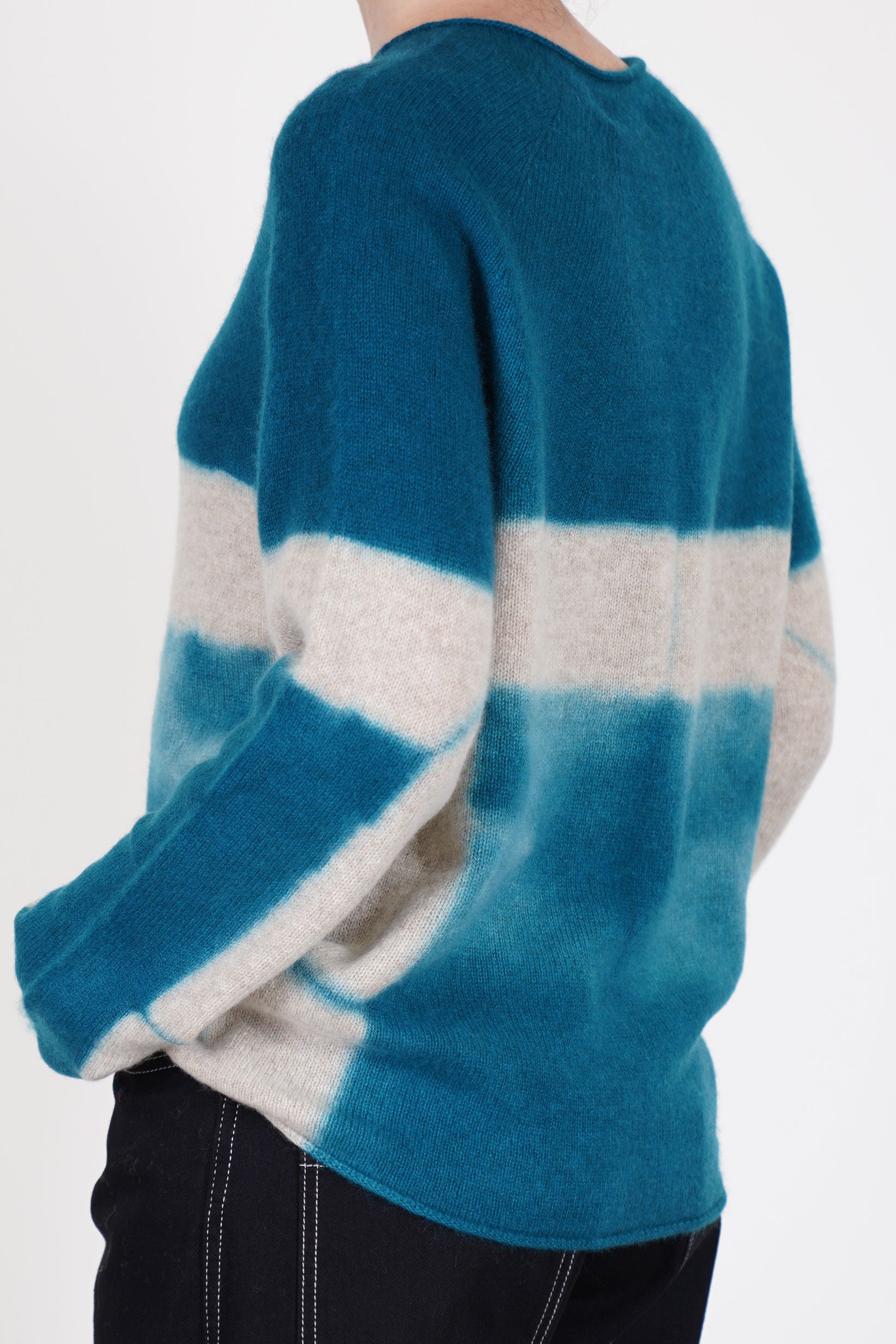back view of suzusan cashmere seamless pullover long dark teal sand hand dyed using the itajime shibori books technique