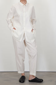 model wearing toogood acrobat trousers poplin yoghurt with maching top for a modern and minimalist look