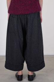 back view of toogood baker trousers wool charcoal they include a low back patch pocket and side pockets for practicality