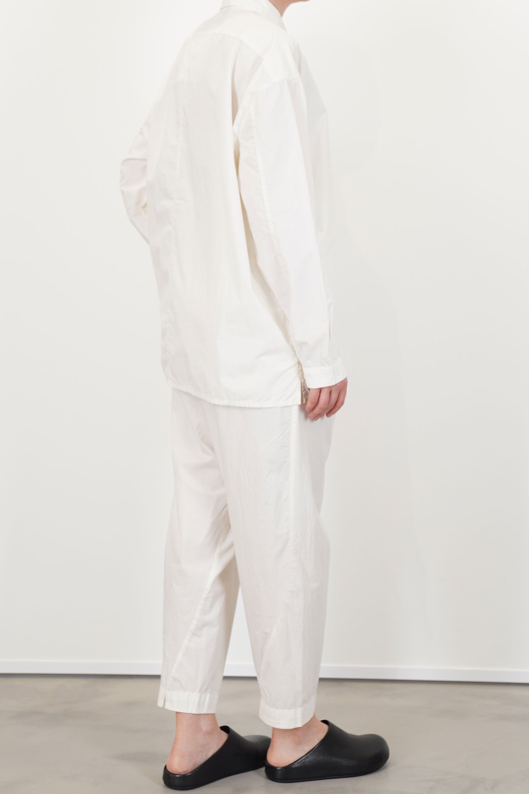 back view of toogood draughtsman shirt poplin yoghurt  straight hem and cut with a loose and relaxed fit