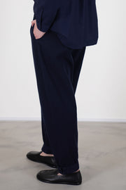 side view of toogood gymast trousers ink side pockets a relaxed fit, crafted from a soft fabric with a gently brushed cotton texture for comfort.