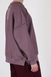 side view of toogood mechanic jumper lilac deliberately exposed stitching and side slit details