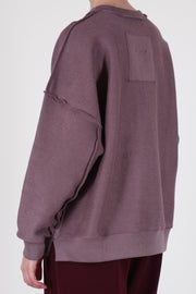 back view of toogood mechanic jumper lilac offers a relaxed, loose fit and unisex model.