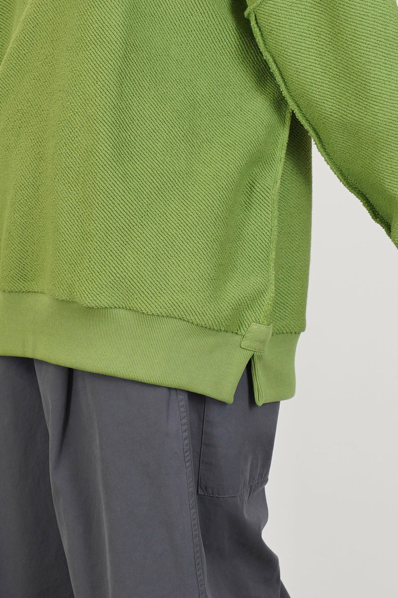 detail view of toogood mechanic jumper loopback twill grass side slit details for an effortless wear
