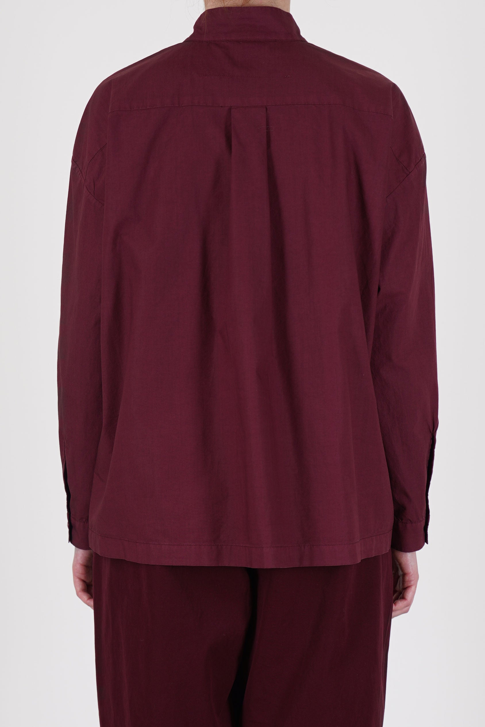 Rear view of Toogood’s poplin shirt in Port – showcasing lightweight fabric and tailored yoke design