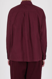 Rear view of Toogood’s poplin shirt in Port – showcasing lightweight fabric and tailored yoke design