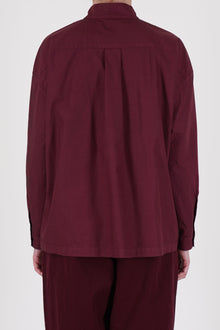 Rear view of Toogood’s poplin shirt in Port – showcasing lightweight fabric and tailored yoke design