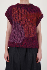 toogood woolen lotter vest in a honeycomb multi pattern features a sleeveless design and a round neckline.