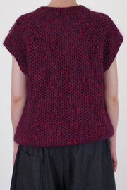 back view of toogood woolen lotter vest in a honeycomb multi pattern where the luxurious material blend for softness, warmth, and durability.